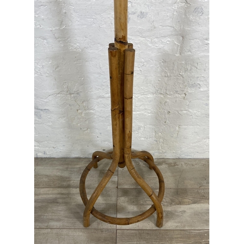 38 - A mid 20th century bamboo and wicker coat stand - approx. 176cm high