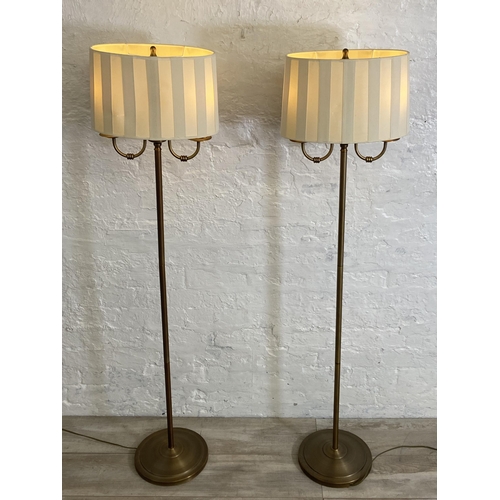 39 - A pair of B&Q Ripley 2L gilt metal two branch floor lamps - approx. 143cm high