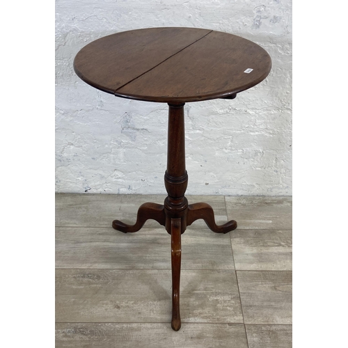 4 - A George III mahogany circular tilt top tripod pedestal side table - approx. 101cm high when tilted ... 