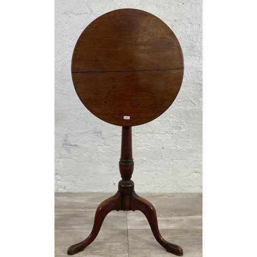 4 - A George III mahogany circular tilt top tripod pedestal side table - approx. 101cm high when tilted ... 