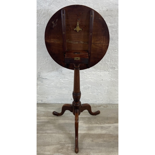 4 - A George III mahogany circular tilt top tripod pedestal side table - approx. 101cm high when tilted ... 