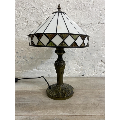 40 - A Tiffany style bronzed metal and stained glass table lamp - approx. 47cm high