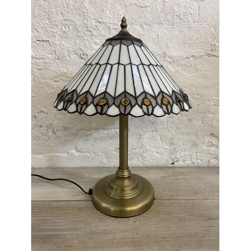 41 - A Tiffany style brushed brass effect and stained glass table lamp - approx. 49cm high