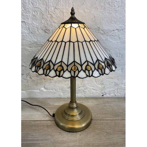 41 - A Tiffany style brushed brass effect and stained glass table lamp - approx. 49cm high