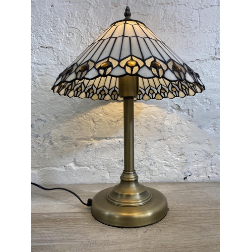 41 - A Tiffany style brushed brass effect and stained glass table lamp - approx. 49cm high