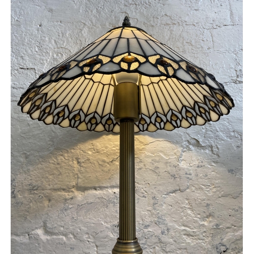 41 - A Tiffany style brushed brass effect and stained glass table lamp - approx. 49cm high