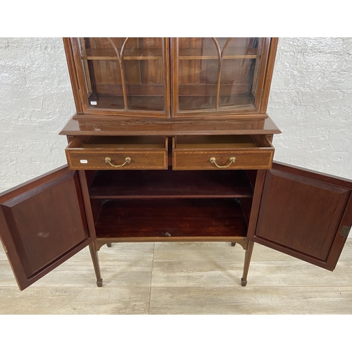 42 - An Edwardian inlaid mahogany bookcase on tapering supports - approx. 179cm high x 90cm wide x 41cm d... 