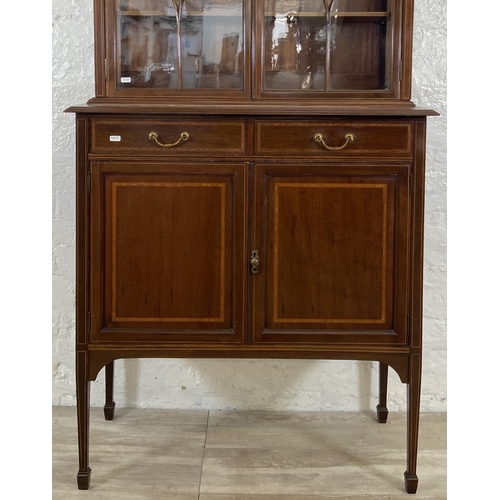 42 - An Edwardian inlaid mahogany bookcase on tapering supports - approx. 179cm high x 90cm wide x 41cm d... 