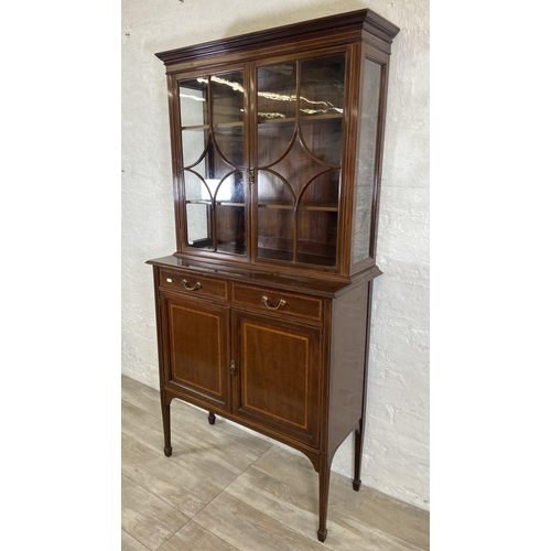 42 - An Edwardian inlaid mahogany bookcase on tapering supports - approx. 179cm high x 90cm wide x 41cm d... 