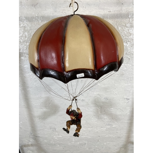 54 - A 1970s Allan Agohob hand painted plaster and resin parachute and clown hanging figurine - approx. 7... 