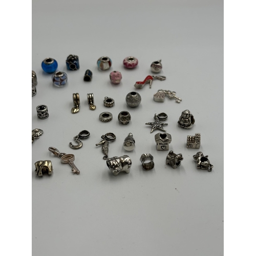 2151 - Thirty seven .925 silver charms