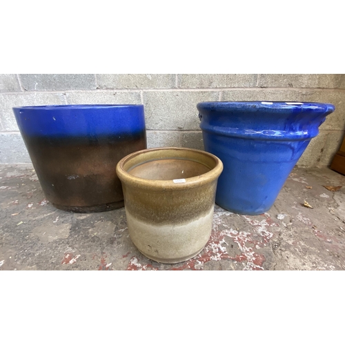 101 - Three glazed terracotta planters - largest approx. 41cm high x 48cm wide x 34cm deep