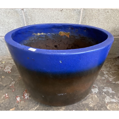 101 - Three glazed terracotta planters - largest approx. 41cm high x 48cm wide x 34cm deep