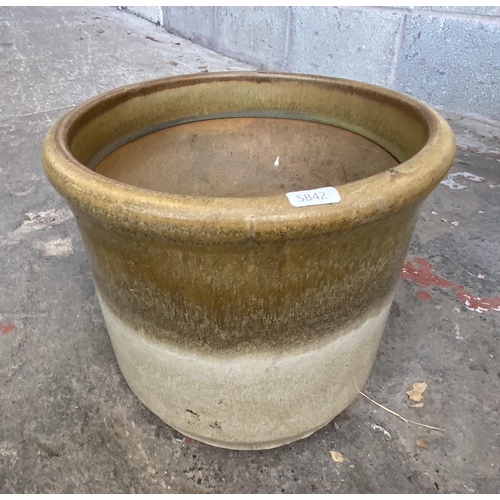 101 - Three glazed terracotta planters - largest approx. 41cm high x 48cm wide x 34cm deep