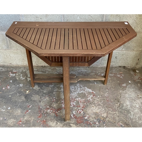 106 - A teak octagonal drop leaf gate leg garden table