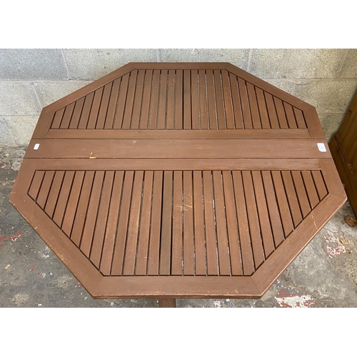 106 - A teak octagonal drop leaf gate leg garden table