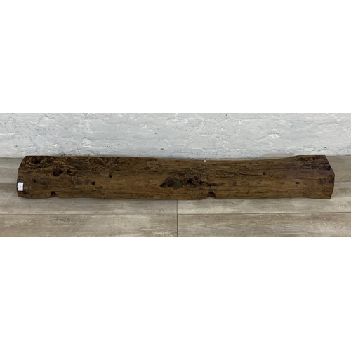 107 - A rustic oak mantel piece - approx. 145cm long