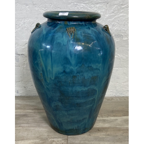 114 - A large blue drip glazed terracotta garden planter - approx. 67cm high