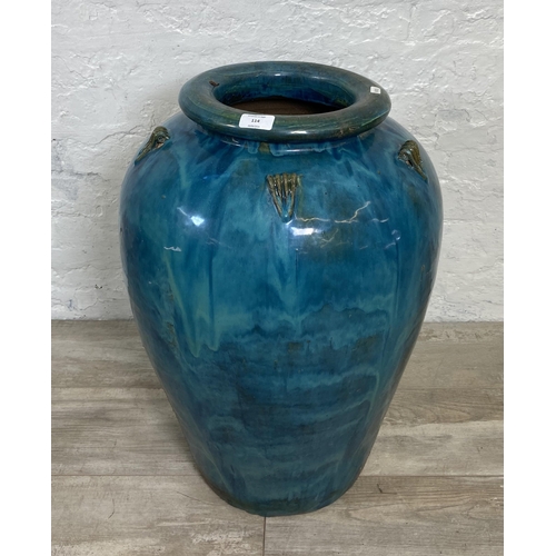 114 - A large blue drip glazed terracotta garden planter - approx. 67cm high