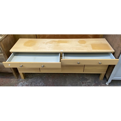 115 - A modern light oak sideboard with four cupboard doors and two drawers - approx. 67cm high x 156cm lo... 