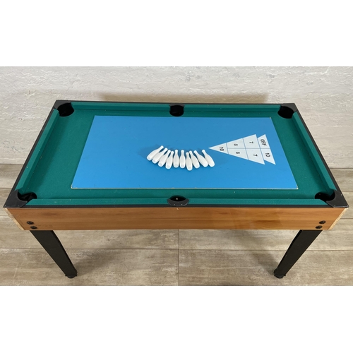 124 - A multi-games table to include table football, pool, table tennis, skittles, air hockey etc.