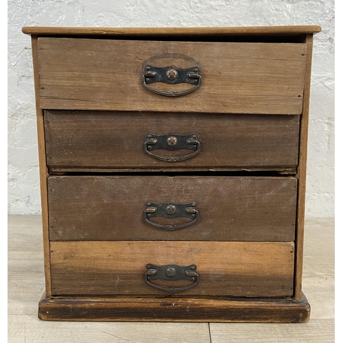 128 - An early 20th century miniature mahogany chest of four drawers - approx. 38cm high x 35.5cm wide x 3... 