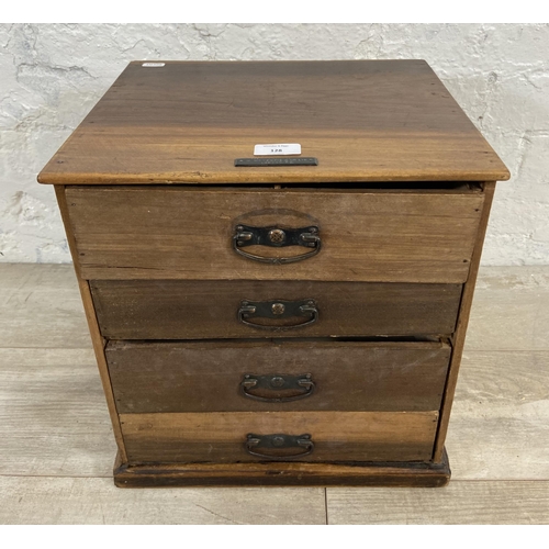 128 - An early 20th century miniature mahogany chest of four drawers - approx. 38cm high x 35.5cm wide x 3... 