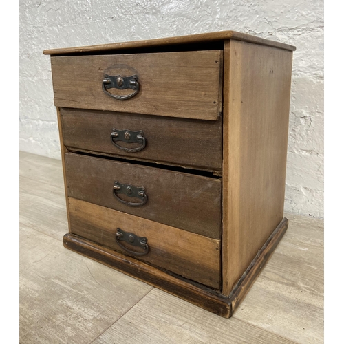 128 - An early 20th century miniature mahogany chest of four drawers - approx. 38cm high x 35.5cm wide x 3... 