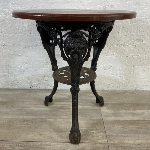 129 - A Victorian Gaskell & Chambers Ltd. of Birmingham cast iron pub table with later added circular oak ... 