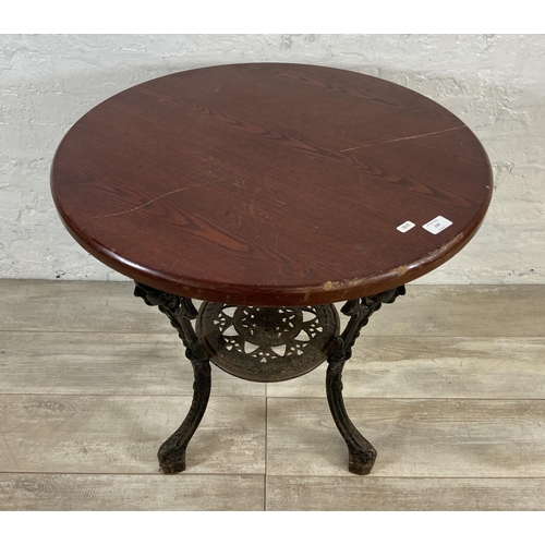 129 - A Victorian Gaskell & Chambers Ltd. of Birmingham cast iron pub table with later added circular oak ... 