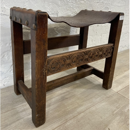 130 - An Antique Reproductions of Worcester carved oak and brown leather stool - approx. 45cm high x 50cm ... 