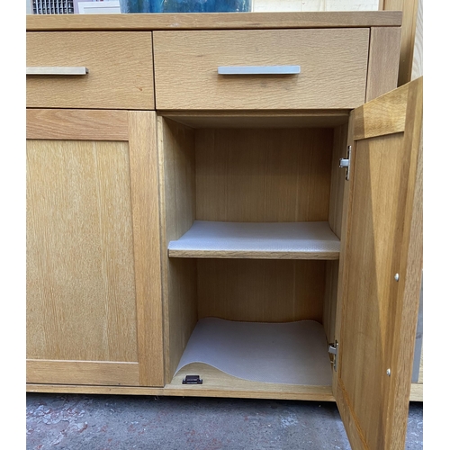 143 - A light oak sideboard with three lower cupboard doors and three drawers - approx. 82cm high x 130cm ... 