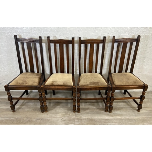 154A - A set of four 1940s oak dining chairs