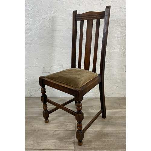 154A - A set of four 1940s oak dining chairs