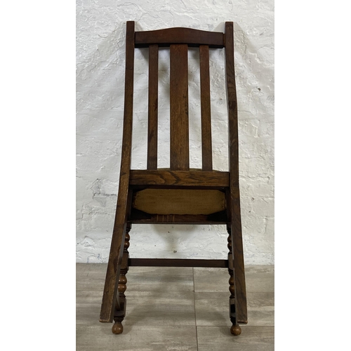 154A - A set of four 1940s oak dining chairs