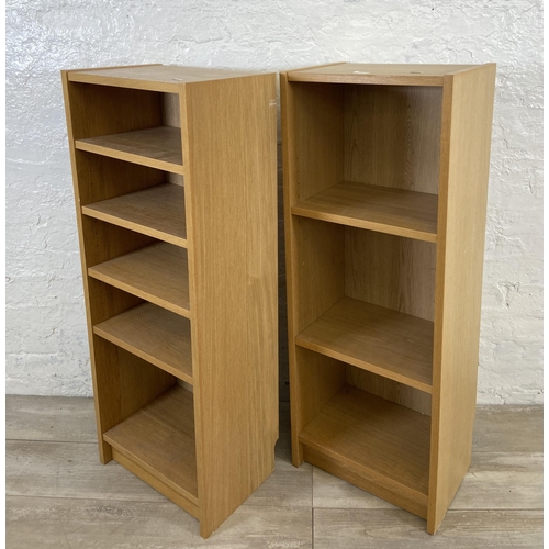 161 - A pair of IKEA Billy oak effect bookcases - approx. 106cm high x 40cm wide x 28cm deep