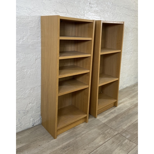 161 - A pair of IKEA Billy oak effect bookcases - approx. 106cm high x 40cm wide x 28cm deep