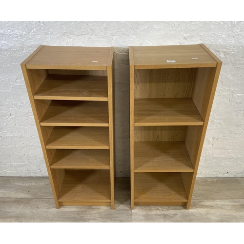 161 - A pair of IKEA Billy oak effect bookcases - approx. 106cm high x 40cm wide x 28cm deep