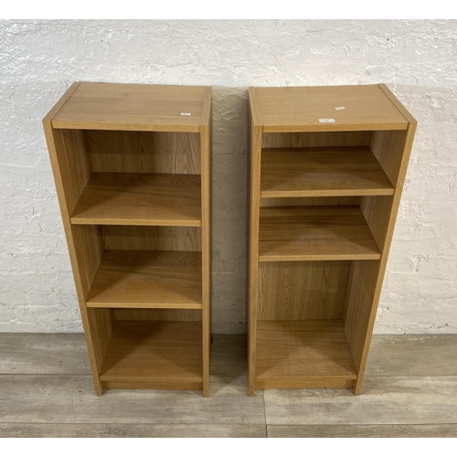 162 - A pair of IKEA Billy oak effect bookcases - approx. 106cm high x 40cm wide x 28cm deep