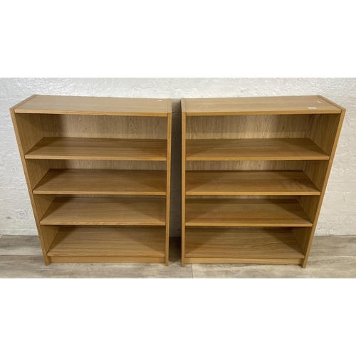 164 - A pair of IKEA Billy oak effect bookcases - approx. 106cm high x 80cm wide x 28cm deep