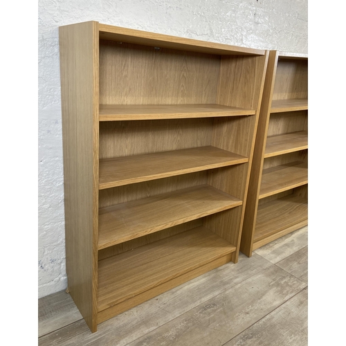 164 - A pair of IKEA Billy oak effect bookcases - approx. 106cm high x 80cm wide x 28cm deep