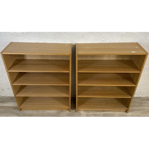 164 - A pair of IKEA Billy oak effect bookcases - approx. 106cm high x 80cm wide x 28cm deep