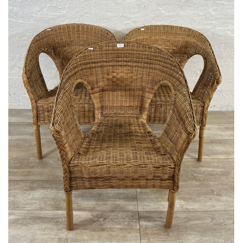 186 - A set of three stacking wicker armchairs