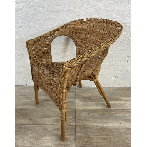 186 - A set of three stacking wicker armchairs