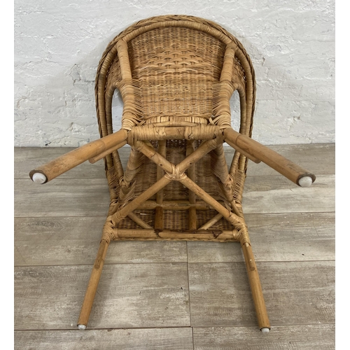 186 - A set of three stacking wicker armchairs