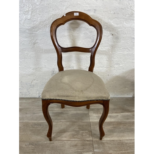 209 - A set of four Victorian style beech balloon back dining chairs