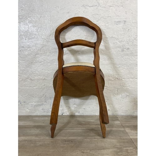 209 - A set of four Victorian style beech balloon back dining chairs