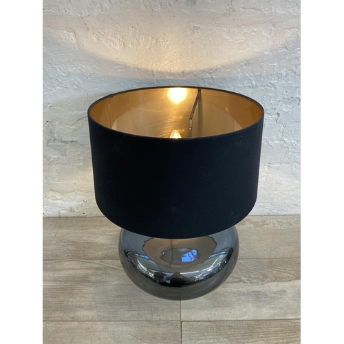 210 - A contemporary grey glass table lamp with black shade