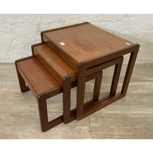 212 - A mid 20th century teak nest of three tables