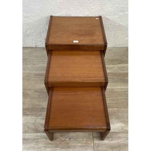 212 - A mid 20th century teak nest of three tables